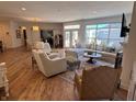 Spacious living room with hardwood floors, large windows, and stylish decor at 2460 Collins Dr, Westfield, IN 46074
