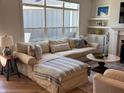 Cozy living room featuring a comfortable sectional sofa, a fireplace, and built-in shelving at 2460 Collins Dr, Westfield, IN 46074
