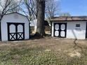 Storage sheds featuring black and white painted doors at 2750 Kristen E Dr, Indianapolis, IN 46218