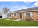 Lovely single-story brick home with well-kept lawn and a practical carport at 2770 Two Worlds Dr, Columbus, IN 47201