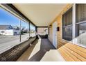 Covered porch with brick accents, wood siding, and a concrete floor at 3006 W 10Th St, Indianapolis, IN 46222