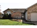 Charming single-story home with a brick facade, two-car garage, and well-manicured lawn at 3513 Berkdale Dr, Columbus, IN 47203