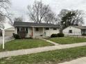 Front exterior of a charming single-story home with a well-maintained lawn and inviting curb appeal at 428 E Trevor St, Brownsburg, IN 46112