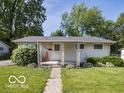Single-story home with a well-maintained lawn and covered front porch at 428 E Trevor St, Brownsburg, IN 46112