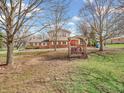 Inviting backyard featuring a charming porch swing and a spacious, well-maintained lawn at 6347 St Joe Dr, Indianapolis, IN 46217