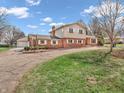 Large home exterior with a detached garage, spacious lawn, and long driveway at 6347 St Joe Dr, Indianapolis, IN 46217