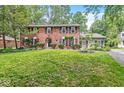 Attractive two-story brick home with manicured lawn and mature plantings at 7138 Avalon Trail Ct, Indianapolis, IN 46250