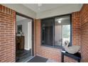 View of the front porch showing a stylish swan statue and indoor entrance at 9242 Golden Leaf Way, Indianapolis, IN 46260