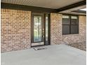 Up close view of the home's brick facade and attractive glass front door at 153 Terrace Ct, Franklin, IN 46131