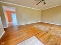 The living room has hardwood floors and is bathed in natural light at 1761 Country Lane Dr, Greenfield, IN 46140