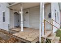 Inviting front porch features classic white columns and wood flooring at 1911 Wilcox St, Indianapolis, IN 46222