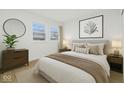 Relaxing bedroom with neutral tones, hardwood floors, and natural light from the window at 3105 N Tacoma Ave, Indianapolis, IN 46218