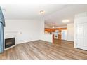 Bright and open floor plan with laminate floors connecting the living room to the kitchen at 3818 Gray Pond Ct, Indianapolis, IN 46237