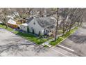Property showcasing lush landscaping, an inviting front porch, and a well-maintained exterior at 490 W Walnut St, Zionsville, IN 46077