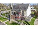 Lovely home showing a beautifully maintained lawn, landscaping, and inviting front porch at 490 W Walnut St, Zionsville, IN 46077