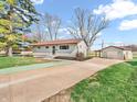 Cozy home with a detached garage, expansive driveway, and newly seeded lawn at 533 E Ulen Dr, Lebanon, IN 46052