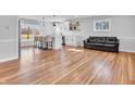 Bright, open-concept living area featuring hardwood floors, a modern kitchen, and plenty of natural light at 533 E Ulen Dr, Lebanon, IN 46052
