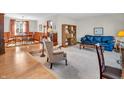 Inviting living room featuring hardwood floors, plush seating, and an open layout at 641 Beech W Dr, Plainfield, IN 46168