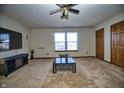 Living room featuring neutral carpet, a modern TV, and bright natural light at 8358 Balmoral Dr, Avon, IN 46123