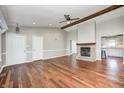 Spacious living room with a fireplace, wood beam, and hardwood floors at 901 W 250 N, Lebanon, IN 46052