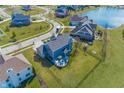 Scenic aerial view of the backyard showing the large yard, patio set, and beautiful neighborhood at 1043 Palomar Dr, Westfield, IN 46074