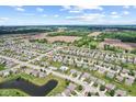 Expansive aerial view shows neighborhood layout and surrounding farmland at 10522 Hunters Crossing Blvd, Indianapolis, IN 46239