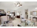Spacious living room with two large chairs, neutral walls, and a ceiling fan at 10629 Medinah Dr # 1, Indianapolis, IN 46234