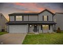 Attractive two-story house with a well-kept lawn, a two-car garage, and a welcoming entrance at 12198 Blue Springs Ln, Fishers, IN 46037