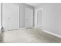 Comfortable bedroom with soft carpeting, neutral paint, and plenty of closet space at 1313 W Memorial Dr, Muncie, IN 47302
