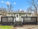Charming home with a welcoming front porch and well-maintained landscaping at 15473 Martha St, Fortville, IN 46040