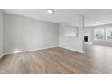 Open-concept living room with new vinyl flooring, fresh paint, and abundant natural light at 2405 Providence Ct, Greenwood, IN 46143