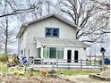 The backyard features a large deck and sunroom, creating a perfect outdoor living space at 3030 N 600 E, Lebanon, IN 46052