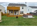 Spacious backyard featuring a wooden deck, a lower patio and a hot tub at 373 Springfield Cir, Greenwood, IN 46143