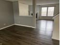 Spacious living room with hardwood floors, neutral paint, a fireplace, and natural light at 373 Springfield Cir, Greenwood, IN 46143