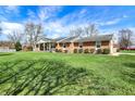 Well-maintained brick ranch home on a spacious, grassy lot with mature trees at 3940 E 600 N, Columbus, IN 47203
