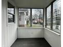 Bright sunroom featuring multiple windows and a neutral color scheme at 4151 Bowman Ave, Indianapolis, IN 46227