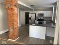 Modern kitchen with stainless steel appliances, white cabinets, and a functional island at 430 Parkway Ave, Indianapolis, IN 46225