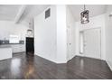 Bright living room boasting an open concept, modern lighting, and dark wood floors at 6036 Terrytown Pkwy, Indianapolis, IN 46254