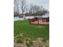 The backyard features a deck, a shed, and ample green space for outdoor activities at 7497 Grandview Dr, Avon, IN 46123
