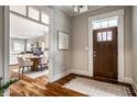 Welcoming foyer with hardwood floors and views into the dining and living areas at 768 Trailside Dr, Carmel, IN 46032