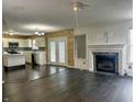Spacious living room with fireplace and open layout connected to the kitchen, perfect for entertaining at 10711 Regis Ct, Indianapolis, IN 46239