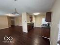 Open-concept kitchen with wood cabinets and modern appliances at 11876 Wapiti Way, Noblesville, IN 46060