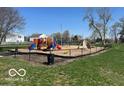 Community playground with swings, slides, and climbing structures at 11876 Wapiti Way, Noblesville, IN 46060