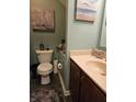 Cozy bathroom with decorative accents and wood-look flooring at 13124 S Elster Way, Fishers, IN 46037