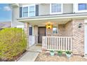 Charming front porch with brick columns, white railing, and a cozy entrance at 20107 Marie Ct, Noblesville, IN 46062