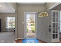 Bright entryway with front door and view of landscaped front yard at 203 Winslow Dr, Westfield, IN 46074