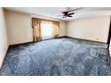 Spacious living room with a large window, neutral walls and carpeted floors at 204 W Berry St, Alexandria, IN 46001