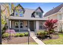Beautiful home with a cozy porch, manicured shrubs, and a neatly paved walkway at 2349 N Delaware St, Indianapolis, IN 46205