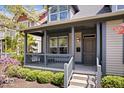 Inviting front porch with gray railings and stairs leading to the main entrance at 2349 N Delaware St, Indianapolis, IN 46205