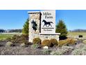 Stone sign reading 'Miles Farm The Estates' with a horse silhouette and decorative landscaping at 286 Lar Lan Dr, Danville, IN 46122